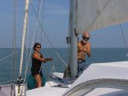 Claire tails while Jerry raises mainsail.JPG (73 KB)